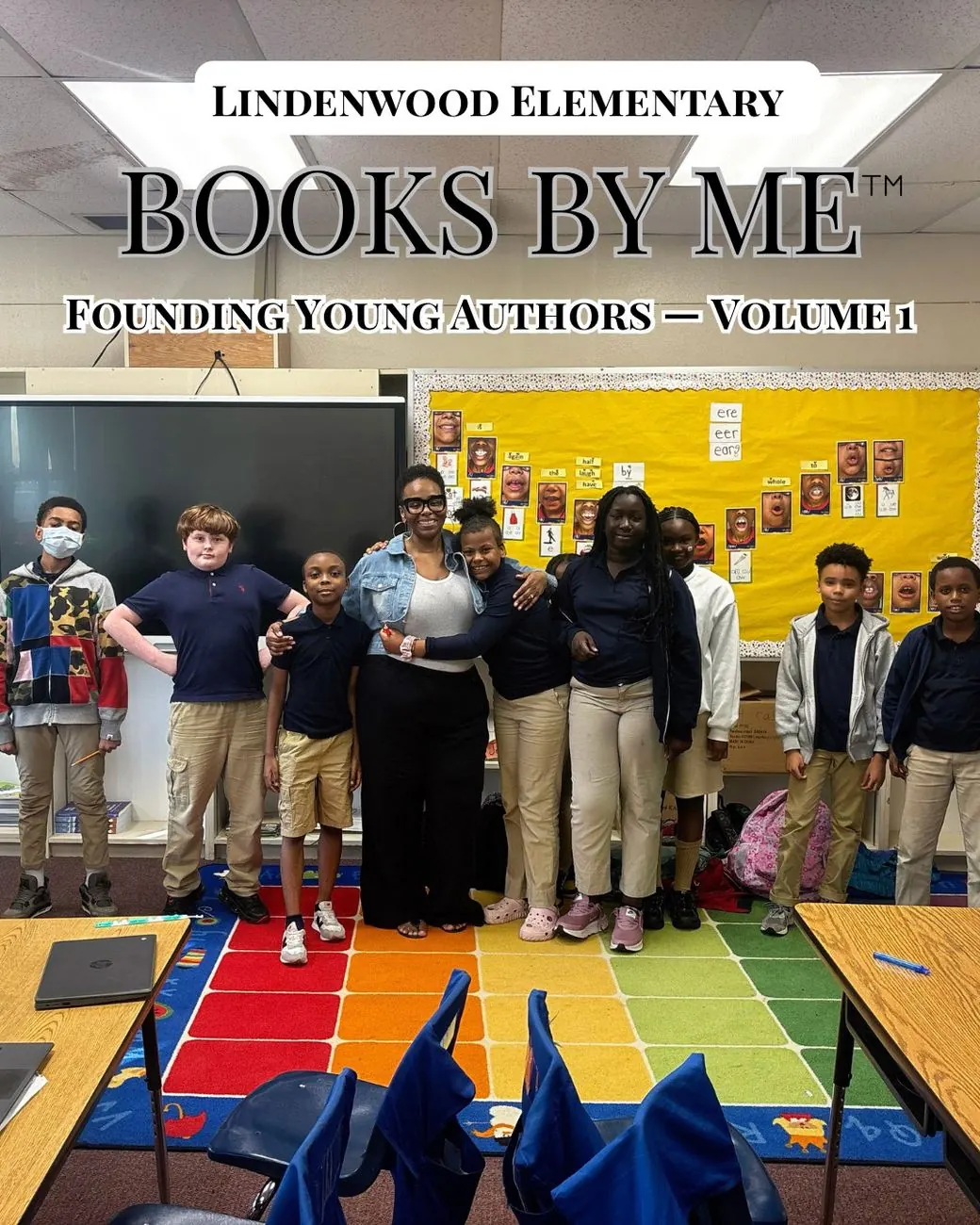 Paula Banks with published student authors holding their books at a library celebration